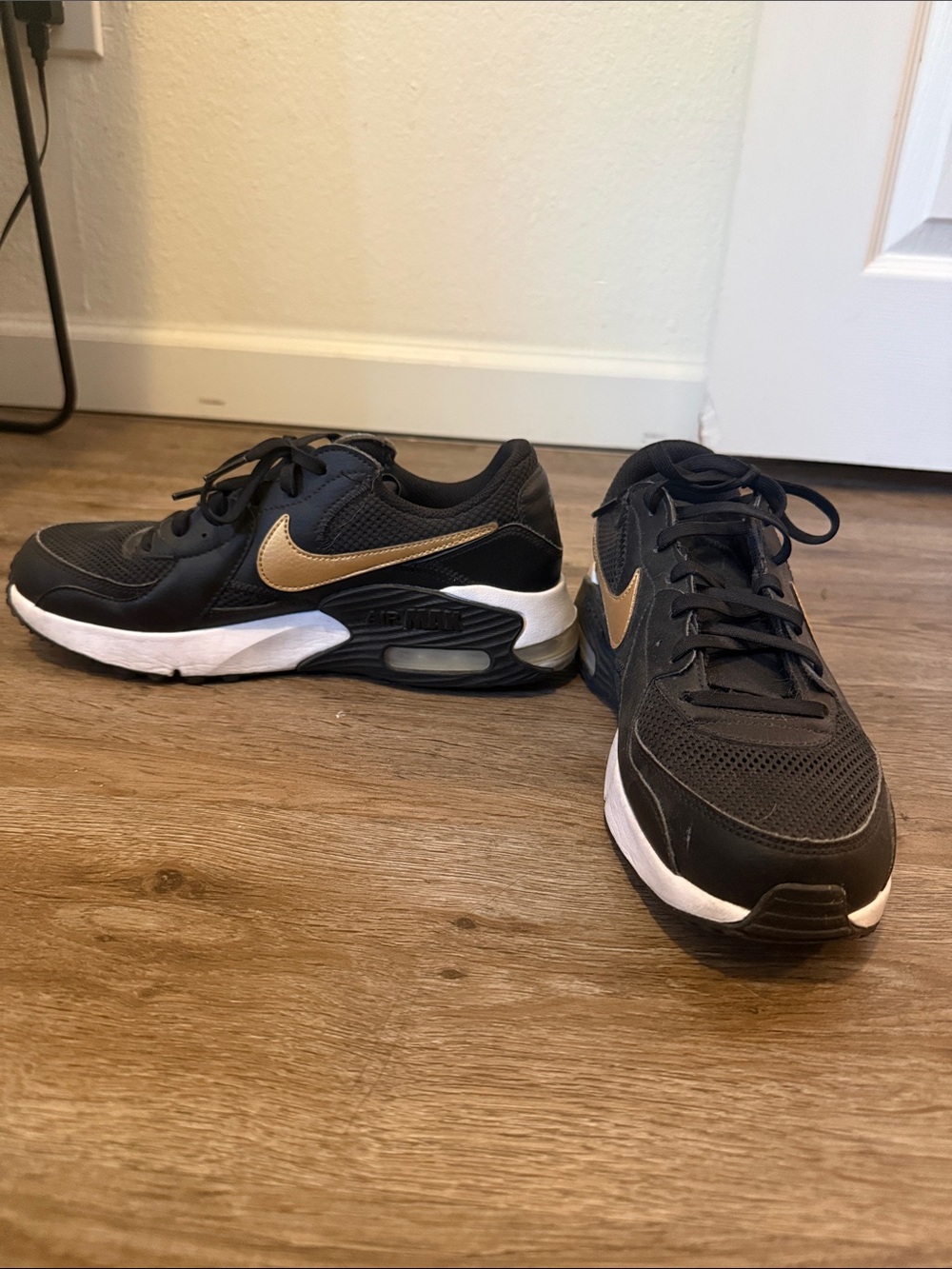 Nike Air Max women’s Black and Gold Athletic Sneakers